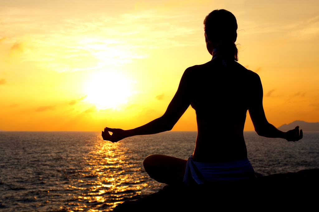 bigstockphoto_Meditating_By_The_Sea_1059748