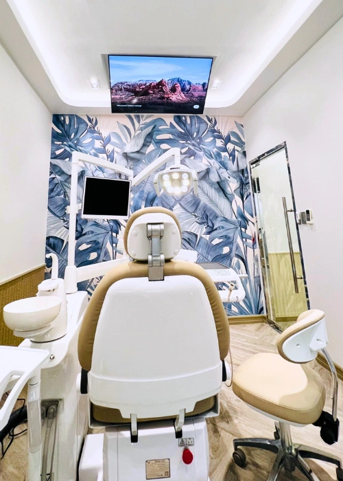 Dental chair with ceiling TV and tropical-inspired wallpaper at Affinity Dental Clinics BGC Stopover