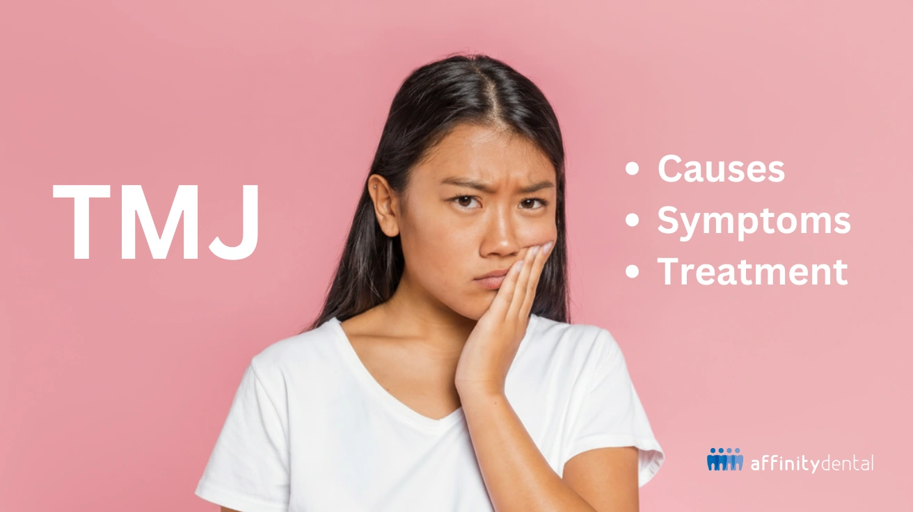 Woman holding her jaw in pain, representing TMJ disorder causes, symptoms, and treatment at Affinity Dental Clinics
