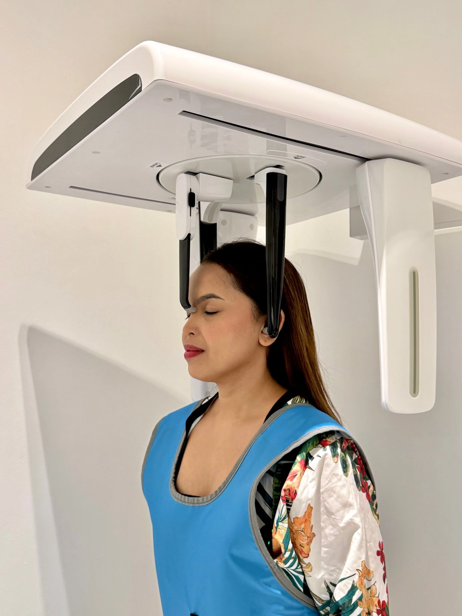 Female patient undergoing a cephalometric X-ray for orthodontic treatment planning at Affinity Dental Clinics Makati