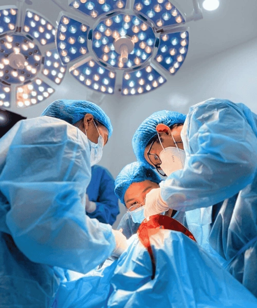 Oral surgeons performing dental implant surgery in the sterile operating room of Affinity Dental Clinics Makati.
