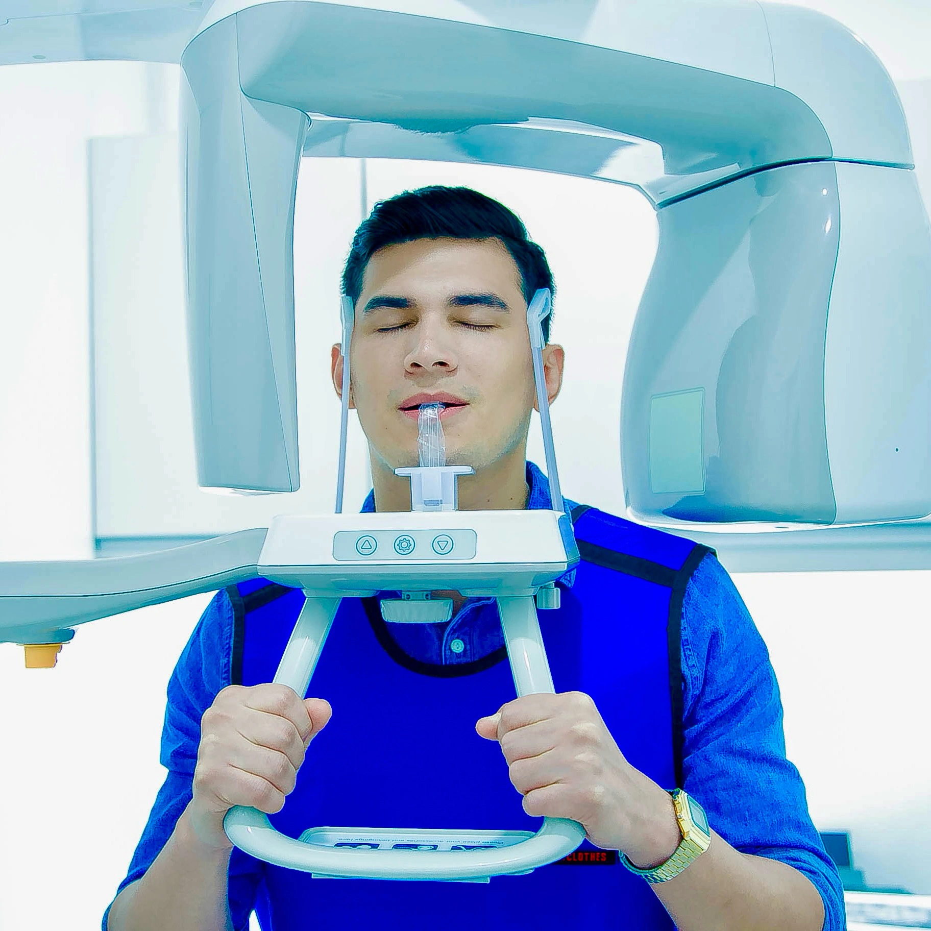 Male patient undergoing panoramic dental X-ray scan at Affinity Dental Clinics Makati for full mouth diagnostic imaging.