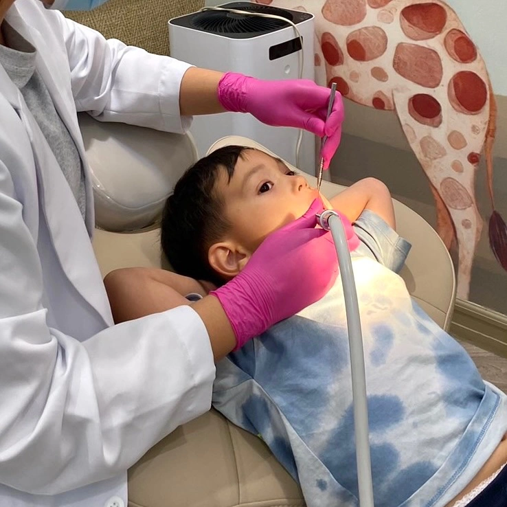 Young boy receiving a tooth filling during a pediatric dental visit at Affinity Dental Clinics BGC Stopover