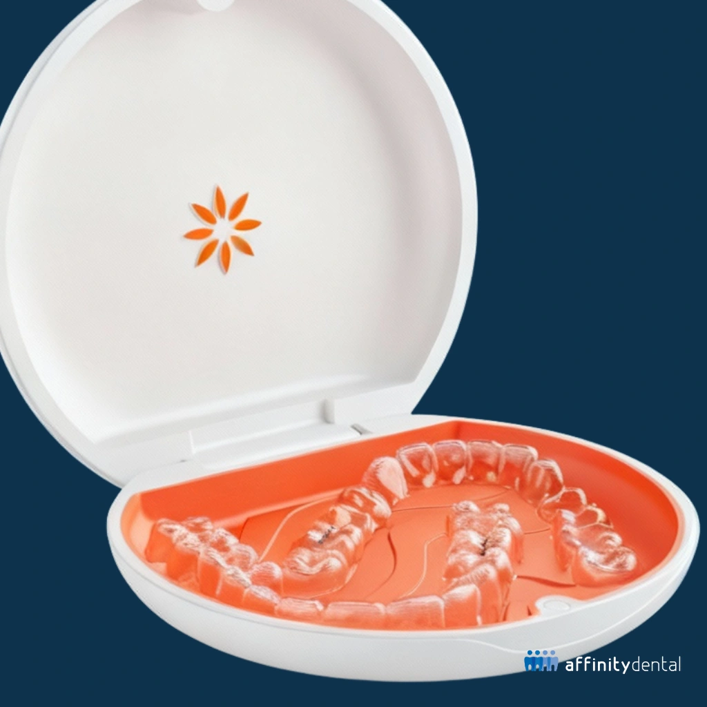Clear Vivera retainers placed inside an orange and white protective case with a floral logo, displayed against a dark blue background.