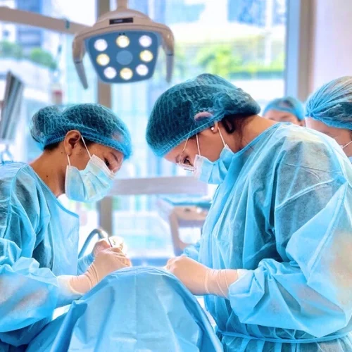 Dentists performing a dental implant procedure at Affinity Dental Clinics BGC High Street in Bonifacio Global City, Manila