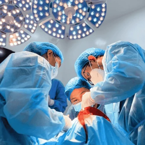 Oral surgeons performing dental implant surgery in the sterile operating room of Affinity Dental Clinics Makati.