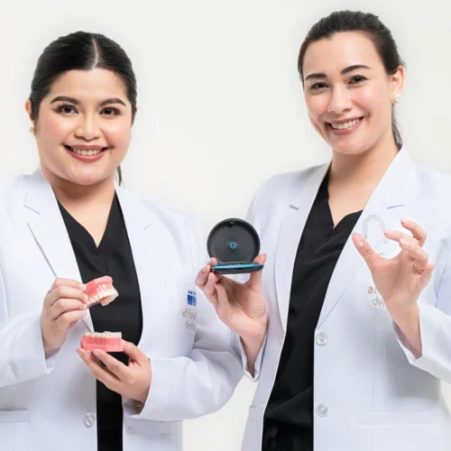 Affinity Dental Clinics dentists holding Invisalign clear aligners and dental models, highlighting their expertise in orthodontic and Invisalign treatment.